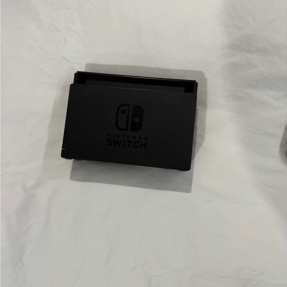 Nintendo Switch with Gray, Purple, and Orange Joy-Con Controllers